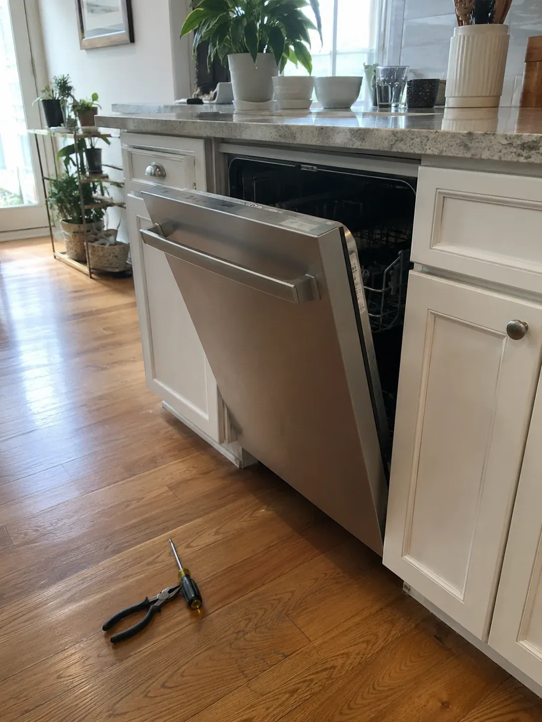 Appliance repair technician at work
